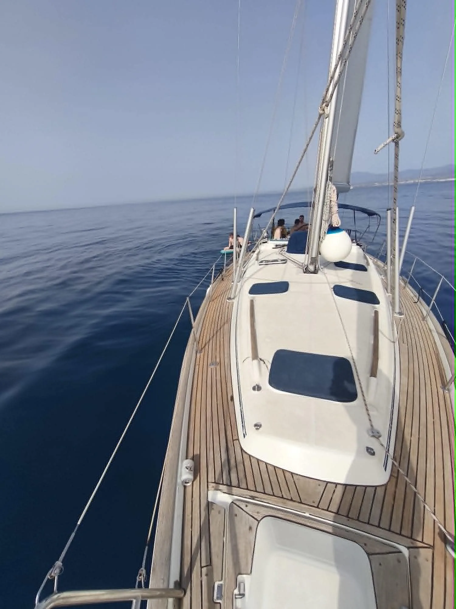 Beneteau Oceanis sailing yacht charter in Marbella & Puerto Banús – bow view underway with sails up and guests on deck